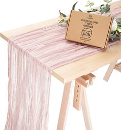 a table with a box and flowers on it