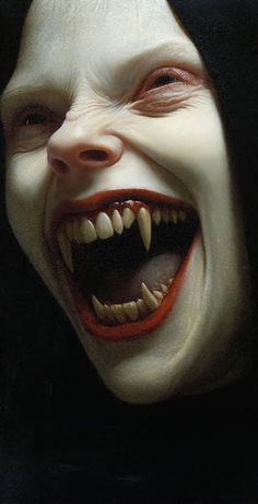 a close up of a person's face with white teeth and red tongues