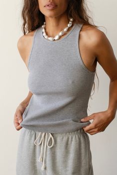 The Rib Tank is our go-to for any look, any season. It holds everything in and does not require a bra underneath. Crafted with our ultra-flattering and comfortable rib fabric, featuring a crewneck, racerback and fine rib texture. Set it up with — The Rib Kick Flare or The Pop Pant Made in LA Scallop Pants, Ribbed Tank Top, Kick Flares, Ribbed Tank, Skirted Swimwear, Ribbed Fabric, Basic Tees, Hoodie Dress, Pacsun