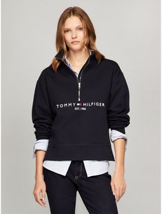 Tommy Hilfiger women's sweatshirt. Ideal for year-round wear, our medium-weight half-zip sweatshirt is made from soft, premium cotton. Designed with a zip placket and ribbed trim, this sporty pullover features our embroidered logo at the chest.  Material: 100% Cotton. Tommy Hilfiger Letter Print Winter Sweatshirt, Winter Tommy Hilfiger Sweatshirt With Letter Print, Tommy Hilfiger Letter Print Sweatshirt For Winter, Casual Tommy Hilfiger Tops With Embroidered Logo, Winter Half-zip Sweatshirt With Letter Print, Half-zip Letter Print Sweatshirt For Fall, Fall Half-zip Sweatshirt With Letter Print, Fall Letter Print Half-zip Sweatshirt, Fall Half-zip Top With Letter Print