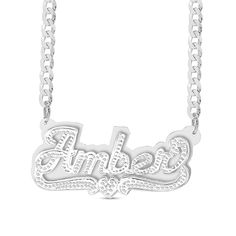 This personalized diamond accent plate necklace spells out your name in an artful way. Sterling silver Features your name - from three to 10 characters in length - sculpted in a stylish script font Scrolling ribbons and a diamond-accented heart shine below Hammered finish Polished plate background 18.0-inch curb chain necklace; lobster claw clasp Silver Nameplate Custom Necklace, Custom Nameplate Necklace In White, Custom Silver Nameplate Necklace, White Custom Nameplate Necklace, Custom White Nameplate Necklace, Custom Engraved Silver Nameplate Necklace, White Gold Nameplate Necklace With Names, Silver Nameplate Necklace For Anniversary, White Nameplate Necklace With Names