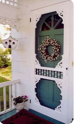 a green door with a wreath on it