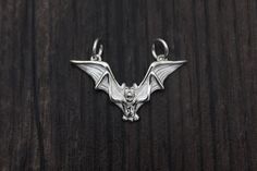 Sterling Silver Bat Charm,Bat Pendant,Sterling Silver Flying Bat Charm,Halloween Charm Material: 925 sterling silver Color: bright silver Size: 29*17mm We have discount for big qty order, pls conver us for details. Collectible Vampire Jewelry For Halloween, Gothic Sterling Silver Charms Jewelry, Gothic Sterling Silver Jewelry With Charms, Sterling Silver Halloween Pendant Jewelry, Silver Halloween Charms Jewelry, Halloween Silver Charm Jewelry, Silver Halloween Jewelry With Charms, Gothic Sterling Silver Jewelry For Halloween, Silver Pendant Jewelry For Halloween