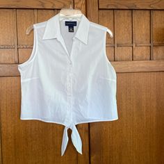 New Charter Club Sleeveless Top. White Cotton Button Up Top With Bottom Ties To Shorten And Show Tummy Or Meet At The Waist Of Your Pants. New And Perfect Condition Size 12 Or Large Armpit To Armpit Measures Approx 21” Length Of The Top Is Approx 20” - Not Tied Sleeveless Button Closure Crop Top, Casual Sleeveless Crop Top With Button Closure, Cropped Summer Vest With Buttons, Summer Cropped Vest With Buttons, Sleeveless Cotton Crop Top With Button Closure, Sleeveless Cotton Crop Top With Buttons, Cropped Vest With Button Closure For Summer, Fitted Sleeveless Crop Top For Daywear, Casual Sleeveless Crop Top For Work