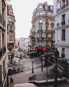 a city street filled with lots of tall buildings