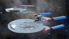 two star trek ships flying through the space