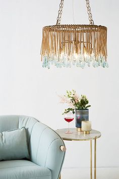 a living room with a blue chair and table