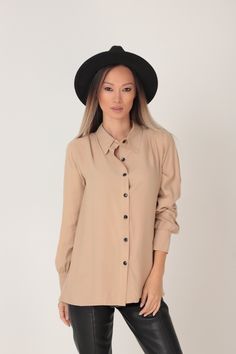 RELAXED BEIGE VISCOSE SHIRT WITH DOUBLE PANEL BACK Every order is sent out worldwide with EXPRESS 2-3 days delivery GARMENT FEATURES: * Relaxed silhouette * Great draping effect and soft touch feel * Beautiful cappuccino beige shade * Classic pointed collar * Double panel back with contrast black buttons in two rows * Front button fastening * Loose long sleeve fit with shirt cuffs SIZING & FITTING: Model is 175cm tall and wears size S. This piece is available in sizes XS-XXL. The outfit is s Casual Beige Office Shirt, Beige Button-up Business Casual Top, Beige Button-up Top For Business Casual, Beige Collared Office Shirt, Beige Spread Collar Top For Business Casual, Beige Button-down Top For Business Casual, Beige Buttoned Top For Business Casual, Beige Button-up Office Shirt, Beige Button-up Shirt For Office