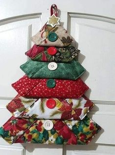 a christmas tree made out of fabric and buttons