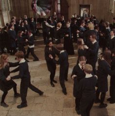 a group of people in suits and ties dancing