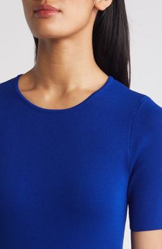 This lightweight, fine-gauge sweater provides a pop of color to perk up your everyday look. Jewel neck Short sleeves 72% rayon, 28% polyester Dry clean Imported Blue Stretch Knit Top For Layering, Layering Blue Textured Knit Tops, Blue Long Sleeve Fine Knit Top, Blue Fine Knit Sweater For Layering, Blue Fine Knit Sweater For Work, Blue Workwear Top With Ribbed Neckline, Classic Blue Tops For Layering, Fitted Blue Fine Knit Top, Fitted Fine Knit Blue Top