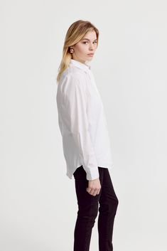 The Icon Shirt runs tailored at the waist, chest and back.  For a contemporary fit, order true size.  For a blousier fit, size up, or consider The Boyfriend Shirt for an even looser look.

 Our perfect fit cotton stretch button down. We designed our best-selling Icon Shirt to be fitted throughout, giving you a body-hugging shape yet eliminating blouse gape completely.  Our cotton stretch is sourced from a family-run mill in Spain and produced in our factory in Portugal by a local team of artisan Slim Fit Top With Spread Collar For Daywear, Fitted Shirttail Hem Shirt For Daywear, Fitted Shirttail Hem Tops For Daywear, Say Bye, The Boyfriend, Boyfriend Shirt, The Shirt, Shirtdress, Bye Bye