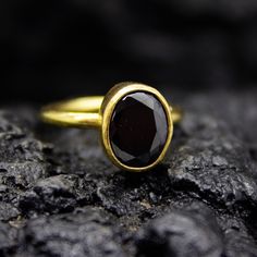 Black Onyx Dainty Stacking Ring | Gold Onyx Statement | 925 Sterling Silver | Handmade Black Gemstone Ring | Christmas Gifts Ring Our shop offer free ring sizing and color options. Handcrafted Hanmade  Ring Metal : 925 Sterling Silver Plating : 24K Gold Band Width : 2 mm Gem Stone : Onyx Gem Size : 11 X 9 mm  Ring Weight : 3.75 grams Ring Size : US 6 (The size you want is made for free). (We used the US standard sizing)  **Custom Orders is Made** As pellada family, we will be happy to help you if you contact us with the photo and dimensions of the design you want. To return back to Pellada Shop Home Page,Click here! https://www.etsy.com/shop/Pellada Thank you for shopping! Pellada Black Rings Gift, Black Birthstone Rings For Gifts, Black Sterling Silver Birthstone Rings, Black Sterling Silver Rings With Birthstone, Minimalist Black Spinel Rings As Gift, Black Spinel Sapphire Ring Gift, Minimalist Black Sapphire Ring For Gift, Minimalist Black Sapphire Ring As Gift, Classic Black Sapphire Ring For Gift