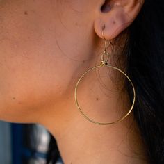 You won’t want to take these hoop earrings off - they are effortless, light and comfortable to wear all day and into the evening. These handmade earrings are perfect for everyday wear. This item is part of the “Hope Line” which consists of introductory pieces made by our new artisans, and tell a powerful story of fresh beginnings. The artisans first learn how to wrap while making these earrings! Included with your purchase of the brass Olivia Earrings will be a polishing cloth and instructions o Everyday Small Hoop Single Earring, Everyday Small Hoop Earrings With Ear Wire, Nickel-free Hoop Earrings For Everyday, Nickel Free Hoop Earrings For Everyday, Metal Open Circle Hoop Earrings, Simple Small Hoop Earrings For Pierced Ears, Hypoallergenic Dangle Hoop Earrings For Everyday, Nickel Free Circular Earrings, Everyday Hoop Earrings With Ear Wire