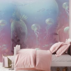 a bedroom with pink bedding and jellyfish wallpaper