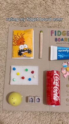 the contents of a board game laid out on the floor, including candy and other items