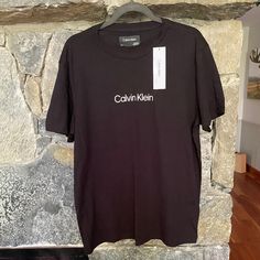 Calvin Klein Black T Shirt Nwt Sz L Black Premium Crew Neck T-Shirt With White Calvin Klein Logo Brand New With Tags - Perfect Condition, Never Worn Comes From A Clean, Smoke And Pet-Free Home Basic Crew Neck Calvin Klein T-shirt, Basic Calvin Klein Crew Neck T-shirt, Calvin Klein Relaxed Fit Crew Neck T-shirt, Calvin Klein Basic Short Sleeve Tops, Calvin Klein Graphic Tee Crew Neck, Calvin Klein Graphic Tee With Crew Neck, Calvin Klein Relaxed Fit Casual T-shirt, Calvin Klein Cotton Crew Neck Top, Calvin Klein Graphic Tee Short Sleeve T-shirt