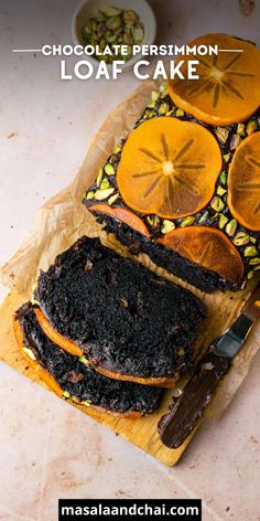 chocolate persimmon loaf cake with sliced oranges and nuts on the side, ready to be eaten