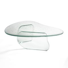 a glass table that is shaped like a shoe