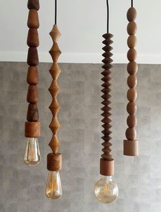 several wooden lights hanging from the ceiling