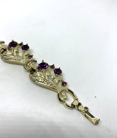 Vintage Lisner purple rhinestone bracelet Gorgeous deep dark purple round glass stone accents 7 inches long 3/4 inch wide Fold over clasp Signed Lisner In good vintage condition. with a couple of small spots of light tarnish. see photos. Formal Crystal Bracelet With Stones, Elegant Round Purple Crystal Bracelet, Elegant Purple Round Crystal Bracelet, Jeweled Bracelets For Formal Occasions, Purple Rhinestone Bracelets As Gift, Purple Rhinestone Bracelets For Gifts, Purple Rhinestone Bracelets Perfect For Gifts, Purple Rhinestones Jewelry For Anniversary, Purple Rhinestone Jewelry For Anniversary