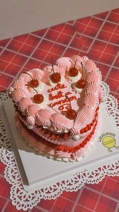 two heart shaped cakes sitting on top of a table