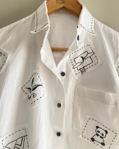 Very fancy and unique shirt, handcrafted print and stitched work on it White Resort Wear, Linen Clothes Boho, Embroidery Shirt Men, Cotton Blouse Design, Stylish Kurtis Design, Printed Linen Fabric, Embellished Shirt, Trendy Shirt Designs, Surat Gujarat