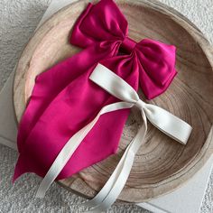 As the newest addition to our bow collection, the luxe silk bow does not disappoint. This oversized bow elevates and adds a pop to any holiday outfit. - Material: Satin - Size: 8.9(L) x 12.6(H) inches - Tight, clasping barrette closure - Designed with love in San Diego Shop the rest of our bow collection here FAQ click here Return Policy click here Chic Satin Bow For Spring, Summer Party Bow With Bow Tie Back, Pink Ribbon Bow For Spring, Chic Evening Bow For Spring, Pink Bow For Spring Party, Chic Detachable Bow For Summer, Elegant Bow For Gift In Spring, Chic Summer Bow, Elegant Summer Bow For Gifts