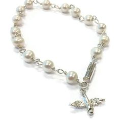 This pearl bracelet created by Jewelry By Carmal is made of: white freshwater pearls, sterling silver: dove charm, spring ring clasp and findings. This bracelet measures 7 1/2 inches in length. View more beaded bracelets: http://www.etsy.com/shop/jewelrybycarmal?section_id=8002918 Pearl is the birthstone for June and the gemstone for the 3rd and 30th Wedding Anniversaries. All of our jewelry arrives wrapped and ready for gift giving! We offer free standard shipping (via USPS) within the United S Wedding Bird, Wedding Birds, 30th Wedding Anniversary, Silver Wedding Jewelry, Bracelet Pearl, Sterling Silver Jewellery, Jewelry Sterling Silver, White Freshwater Pearl, White Bridal