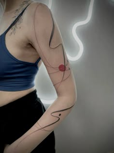 a woman with a tattoo on her arm