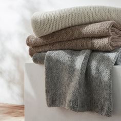 three blankets stacked on top of each other