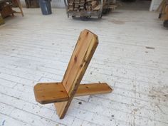 a wooden bench sitting on top of a white floor