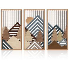 three pieces of art made out of wood with geometric shapes and trees on the sides