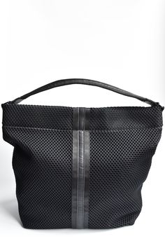 Beautifully layered materials come together to create the perfect hobo bag. Black mesh, webbing and our signature leather is highlighted by a high gloss liner. Large enough for all your essentials, with a little bit of edge. Carry the bag by the sporty handle or on the shoulder with the padded strap. Content:- Mesh- Leather- Imported Size:- Width: 19.75"- Height: 16.25"- Depth: 7"- Handle Drop: 12" Modern Hobo Bag With Leather Trim For Shopping, Modern Shopping Hobo Bag With Leather Trim, Modern Hobo Bag With Leather Trim, Shopping Tote Shoulder Bag With Mesh Lining, Sporty Leather Shoulder Bag With Removable Pouch, Travel Mesh Shoulder Bag With Mesh Lining, Black Nylon Hobo Bag Shaped As A Tote, Modern Nylon Shoulder Bag With Leather Handles, Black Hobo Bag With Leather Trim For Everyday