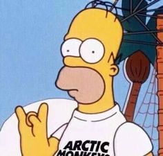 the simpsons is wearing a white t - shirt that says arctic monkeys on it's chest