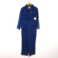 Lee Coveralls Jumpsuit Blue Denim Button Front Zipper Fly Elastic At Waist 100% Cotton Measurements Laying Flat: Chest (Pit To Pit) 20.5" Waist 18" Hips 20" Inseam 28.5" Utility Overalls With Button Closure And Relaxed Fit, Utility Cotton Denim Jumpsuit With Button Closure, Cotton Utility Denim Jumpsuit With Button Closure, Dark Wash Buttoned Cotton Denim Jumpsuit, Utility Style Denim Blue Bib Front Jumpsuit, Utility Denim Blue Jumpsuit With Bib Front, Denim Blue Bib Front Utility Jumpsuit, Utility Denim Jumpsuit With Button Closure, Full-length Denim Blue Jumpsuits And Rompers