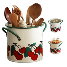 an image of kitchen utensils in a pot with cherries on the side