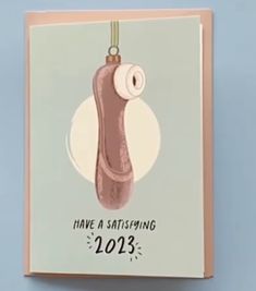 a greeting card with an image of a shoe hanging on a string that says have a satisfieding 2013