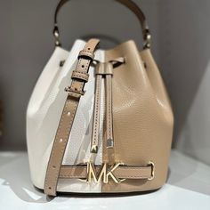 100% Guaranteed Authentic Michael Kors !! Firm Price !! Details : Bucket Bag Leather Gold-Tone Hardware Dimensions: 9.25w X 8.5h X 5.5d Approx Handle Drop: 4.5 Approx Adjustable Strap: 18-21.75 Interior Details: Back Slip Pocket Lining: 100% Polyester Drawstring Fastening Crossbody Strap Included Imported Color : Camel Multi Size : Medium Msrp : $498 **Comes From Smoke & Pet Free Environment ** #Mk #Michael Kors #Wallet #Wristlet #Designerbag #Leather #Newcollection #Gift #Kashcloset #Collection Luxury Michael Kors Neutral Bag, Michael Kors Cream Bag With Adjustable Strap, Michael Kors Brown Bucket Bag, Michael Kors Beige Bag With Detachable Strap, Michael Kors Beige Leather Shoulder Bag, Michael Kors Beige Leather Bag, Luxury Bucket Bag By Michael Kors, Chic Beige Michael Kors Bag, Chic Michael Kors Bucket Bag For Shopping