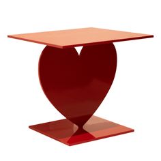 a red table with a heart shaped top on it's base, against a white background