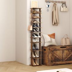 a wooden shoe rack with shoes and purses on it next to a white wall