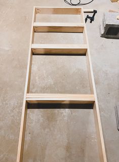 a ladder sitting on top of a cement floor