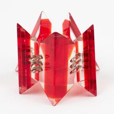 This is part of Chairish’s Costume Jewelry assortment.  Attractive oversized Lucite link bracelet. Geometric links are shaped in laminated transparent and bright red colors with silvered metal hardware. There is no visible maker's mark. Measurements: 8.07 in long (20.5 cm) x 2.38 in wide (6 cm).  Please see the measurements noted above in the description for the best approximate dimensions. Red Plastic Bracelet Jewelry, Modern Red Bracelet Jewelry, Modern Lucite Bracelets As A Gift, Maker's Mark, Best Wear, Metal Hardware, Bright Red, Makers Mark, Link Bracelets