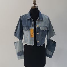 Lizette Collection Denim Jacket Blue Open Elbow And Hem Finished With Raw Edged Flanges For Rugged Street-Style Appeal Length Approximately 18 Inches, Bust 20 Inches And Sleeve Length 21 Inches From Size Small. 100% Cotton Maniqu Small: Bust 35 Inches, Waist 241/2 And Hip 35 Wearing Jacket Size Small Maniqu Large: Bust 43 Inches, Waist 36 And Hip 43 Wearing Jacket Size Medium. Cropped Blue Denim Top For Fall, Blue Denim Cropped Jacket For Fall, Cropped Blue Denim Vest For Fall, Blue Cropped Denim Vest For Fall, Wearing Jacket, Large Bust, Blue Jean, Small Bust, Jean Coat