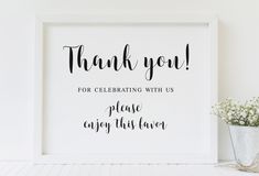 a white framed sign that says thank you for celebrating with us