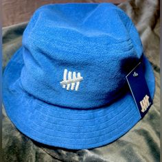 Size S/M Brand New W Tags Unisex Blue Bucket Hat With Flat Brim For Spring, Blue Cotton Bucket Hat With Flat Brim, Blue Winter Bucket Hat With Curved Brim, Blue Winter Bucket Hat, Blue Flat Brim Bucket Hat One Size, Blue Flat Brim Bucket Hat, Winter Blue Bucket Hat, Blue Short Brim Bucket Hat For Streetwear, Blue Bucket Hat For Streetwear