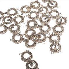 Add a dazzling focal point to your jewelry with our CL/30 Pavé Crystal Round Buckle Clasp. Measuring 35x22mm, this large, round clasp is encrusted with brilliant pavé crystals, creating a stunning display of light and luxury. Its buckle design not only serves as a secure closure but also as an elegant decorative element, making it perfect for statement necklaces and bracelets. Sold individually, this clasp is designed to bring glamour and functionality to your handcrafted jewelry pieces. Materia Silver Jewelry With Rhinestone Round Beads, Silver Sparkling Round Bead Jewelry, Sparkling Silver Bead Jewelry, Jewelry Style, Statement Necklaces, Classic Jewelry, Handcrafted Jewelry, Focal Point, Jewelry Pieces