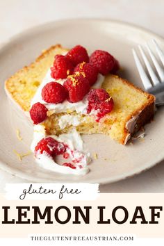 a slice of lemon loaf cake on a plate with raspberries