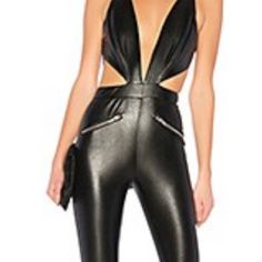 Sexy Faux Leather Cut Out Jumpsuit Black Bodysuit With Zipper For Party, Black Party Bodysuit With Zipper Closure, Fitted Leather Pants With Zipper For Party, Edgy Leather Pants With Zipper Closure For Party, Chic Faux Leather Jumpsuits And Rompers For Night Out, Fitted Faux Leather Jumpsuits And Rompers For Party, Fitted Leather Pants For Club, Black Faux Leather Jumpsuits And Rompers For Night Out, Faux Leather Jumpsuits And Rompers For Party