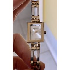 Brand New Battery. This Stunning Anne Klein Wristwatch Boasts A Rectangular Gold And Silver-Tone Metal Band With A White Analog Display Featuring Roman Numerals. This Versatile Timepiece Is Perfect For Any Occasion, Whether It Be A Formal Event Or A Casual Outing. Its Classic And Elegant Design Will Make It A Cherished Addition To Any Collection. Good Condition, A Few Scratches Not Noticeable Except With A Magnifying Glass, Commensurate With Pre-Owned Condition. Silver Watches For Everyday Use, Anne Klein Watch, Watch New, Metal Band, Magnifying Glass, Roman Numerals, Metal Bands, Anne Klein, Formal Event